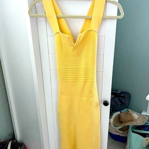 Express dress soft yellow size small. New never worn